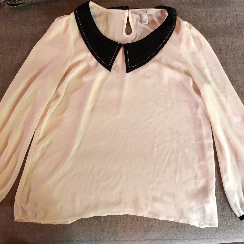 I am selling a white sheer black collar shirt, the original price is 11.99.